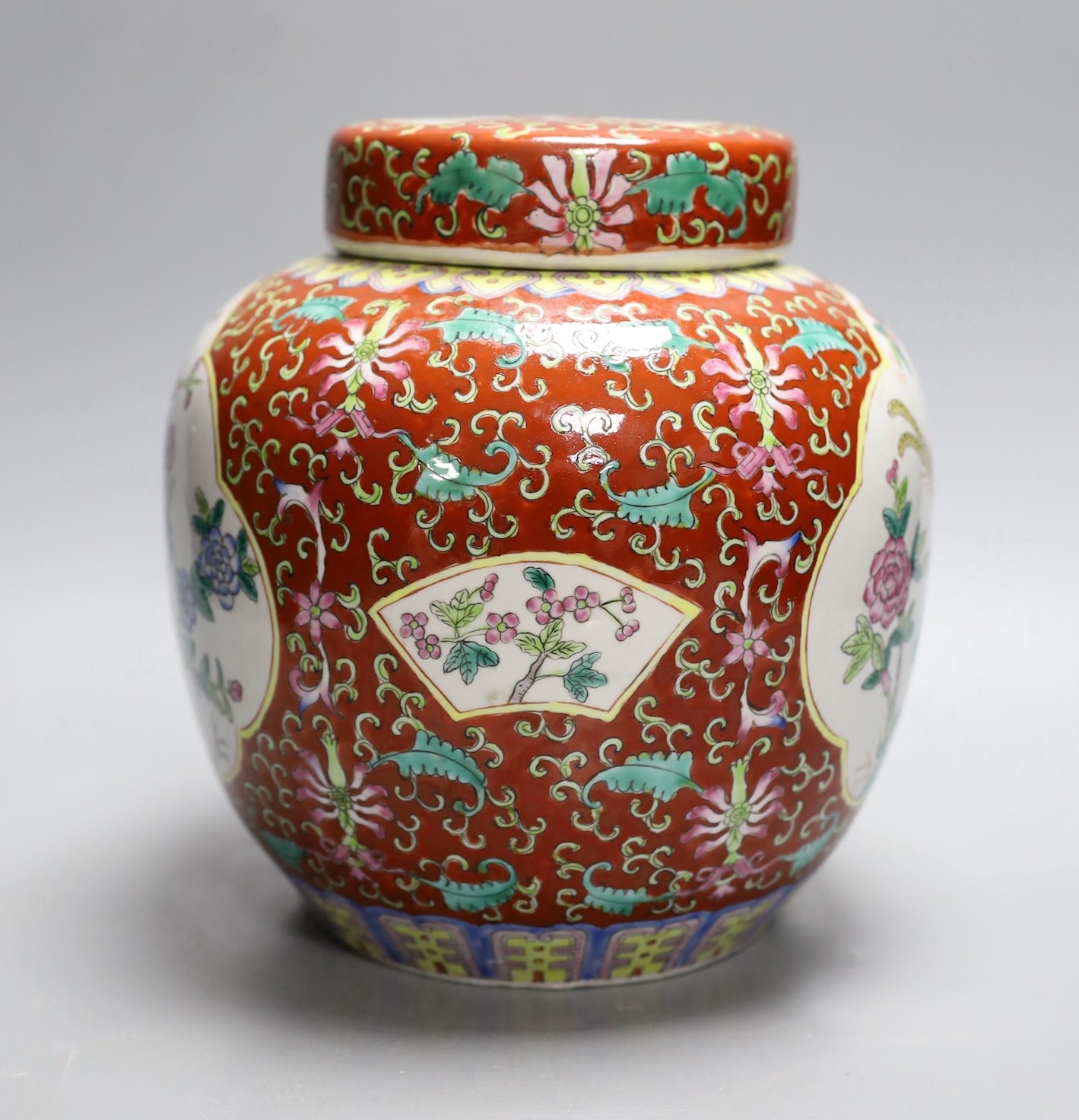 A Chinese coral ground jar and cover, 23cm